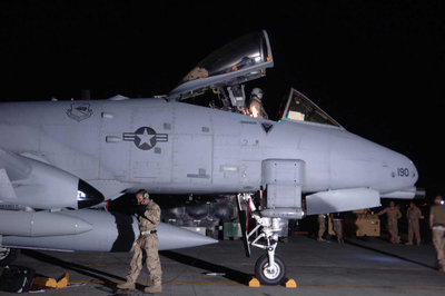 070417-F-Aircrew wait to greet an arriving pilot while maintainers recover an A-10 after it is parked on the ramp at Bagram Airfield_01.jpg